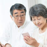 senior couple using a smartphone